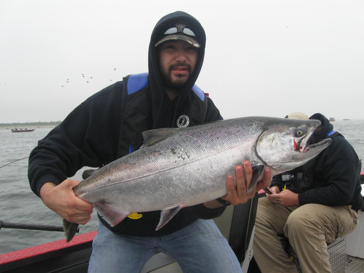 Client Proud to have Caught  Chinook Salmon in the Columbia River | Buoy 10 Fishing Guide